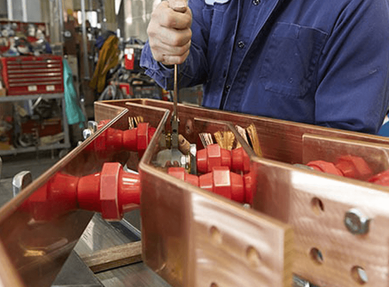 Transformer technician working on dry type transformer.