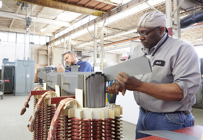 ELSCO technicians working on a custom transformer