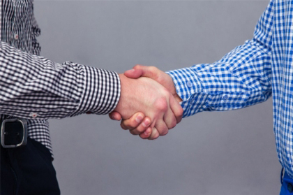 Two men shaking hands.