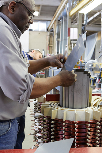 ELSCO worker manufacturing a dry type transformer