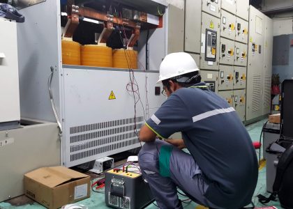 Technician servicing a dry type transformer.