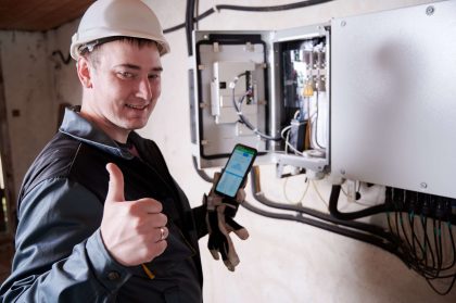 Electrician working on an electrical panel.