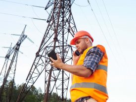 Electrical engineer under an electrical power line.